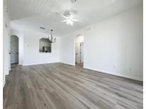 Bright living room featuring new floors and neutral paint for a modern look at 13512 Turtle Marsh Loop # 729, Orlando, FL 32837