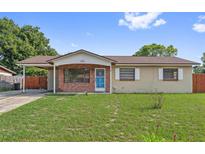 Charming single-story home with a cozy carport, brick accents, and a well-maintained front lawn at 510 Peach Tree Ln, Altamonte Springs, FL 32701