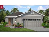 Charming single-story home with a spacious two-car garage and beautifully landscaped front yard at 9108 Wildlight, Wildwood, FL 34785