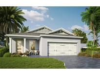 Charming single-Gathering home featuring a two-car garage and welcoming front porch with tropical landscaping at 101 Elena Lavin Cir # 1, Orlando, FL 32807