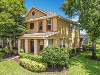 Beautiful two-story home with a well-maintained lawn and mature trees at 13055 Overstreet Rd, Windermere, FL 34786