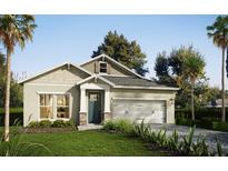 Charming one-story home featuring manicured lawn, neutral colors, and attached two-car garage at 13518 Maria Lavin Circle Rd, Orlando, FL 32828