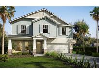 Charming two-story home with large windows, shutters, and a manicured front lawn at 13518 Maria Lavin Circle Rd, Orlando, FL 32828