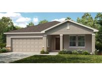 Charming single-story home with a neutral color scheme, two-car garage and landscaped yard at 136 Jones Fish Camp Rd, Edgewater, FL 32141