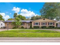Inviting single-story home showcasing a neatly manicured lawn and mature landscaping at 3405 Werber St, Orlando, FL 32806