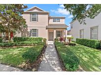 Charming two-story home featuring well-manicured landscaping and a welcoming front entrance at 3426 Schoolhouse Rd, Harmony, FL 34773