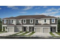 Attractive new construction townhomes featuring modern design and individual garages at 134 River Front Way, Edgewater, FL 32141