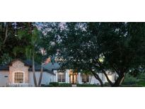 Elegant home exterior featuring stone accents, lush landscaping, and a well-maintained front yard at 2106 Ridgewind Way, Windermere, FL 34786