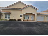 Charming villa features a tile roof, single car garage, and neutral colored stucco at 346 David Walker Dr # K-6, Tavares, FL 32778