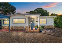 Charming single-Gathering home featuring neutral siding, stone accents, and a welcoming front entrance at 3637 Dubsdread Cir, Orlando, FL 32804