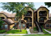 Charming condo complex with well-manicured landscaping, private balcony, and convenient stairway access to multiple units at 420 Forestway Cir # 306, Altamonte Springs, FL 32701