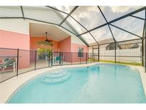 Screened-in pool with covered lanai and steps into the water offering a delightful backyard retreat at 4700 Prairie Point Blvd, Kissimmee, FL 34746