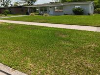 Charming single-story home with a well-maintained front yard and walkway at 2103 Mantilla Ave, Orlando, FL 32811