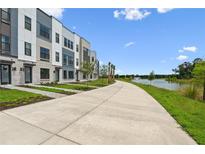 New townhomes with modern design near a scenic lake and paved walking path at 2318 Addalia Aly, Orlando, FL 32804