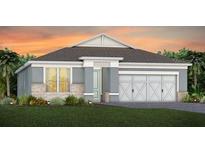 Charming single-story home featuring a three-car garage and well-manicured lawn at sunset at 2609 Clear Night Ave, Kissimmee, FL 34744