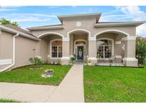 Charming home featuring a well-manicured lawn, inviting front porch, and decorative architectural details at 701 Little Hampton Ln, Gotha, FL 34734