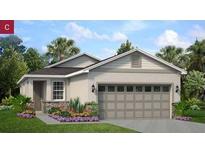 Charming single-story home featuring a manicured lawn, a two-car garage, and stone accents near the entry at 176 Duckweed Ave, Fruitland Park, FL 34731