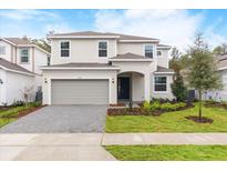 Charming two-story home with a well-manicured lawn and a two car garage at 2261 Sirena Ln, Mount Dora, FL 32757