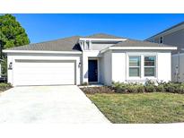 Charming single Gathering home with a two-car garage, manicured lawn, and easy-to-maintain landscaping at 3977 Willowbrook Dr, Edgewater, FL 32141