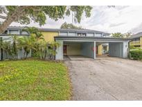 Townhouse with a covered carport, well maintained lawn, and tasteful landscaping at 7475 Canford Ct # 21, Winter Park, FL 32792