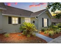 Inviting home exterior featuring tidy landscaping, a walkway, and neutral siding at 1126 Villa Ln # 91, Apopka, FL 32712