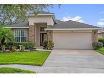 Charming single-Gathering home featuring stone accents and a well-manicured front lawn at 1171 Lebanon Ct, Sanford, FL 32771