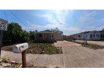 Charming single story home with a quaint covered porch and attached garage at 39 S College Ave, Maitland, FL 32751