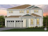Charming two-story home featuring a well-manicured lawn, inviting entryway, and a convenient two-car garage at 411 Winter Grove Blvd, Winter Garden, FL 34787