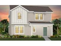 Charming two-story home featuring a modern design with a combination of siding and a well-manicured lawn at 5021 Starling Bird Ln, St Cloud, FL 34771