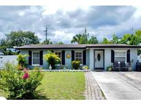 Charming single-story home featuring a well-manicured lawn, classic shutters, and a welcoming front entrance at 517 Ivanhoe Way, Casselberry, FL 32707