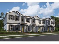 Charming townhomes featuring varied siding, decorative shutters, and covered front porches at 551 Pothos St, Apopka, FL 32703