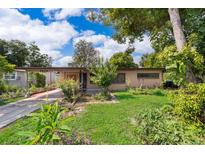 Charming single-story home with well-maintained landscaping and a cozy carport at 5604 Astoria Pl, Orlando, FL 32808