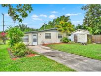 Charming single-story home with well-maintained lawn and a concrete driveway leading to the front door at 1170 E Bay St, Winter Garden, FL 34787