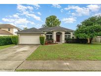 Charming single-story home with well-maintained lawn and inviting curb appeal at 2063 Killinger St, Deltona, FL 32738