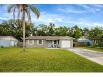 Charming single-story home with a well-maintained lawn and a welcoming front entrance at 2943 Slippery Rock Ave, Orlando, FL 32826