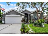 Charming single-Gathering home with well-manicured lawn and two-car garage at 545 Hardwood Cir, Orlando, FL 32828