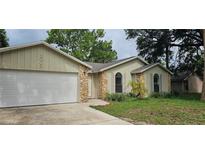 Charming single-Gathering home with a two-car garage and stone accents at 2008 Juniper Dr, Edgewater, FL 32141