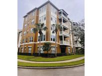 Stunning multi-story condo building with private balconies and well-maintained landscaping at 1200 Ironsmith Dr # 508, Celebration, FL 34747