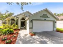 Charming single-story home with well-maintained landscaping and a two-car garage at 139 Andrews Rd, Sanford, FL 32773