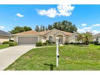 Charming single-story home featuring well-maintained landscaping and inviting curb appeal at 2520 Nw 53Rd Avenue Rd, Ocala, FL 34482