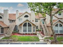 Inviting two-story condo featuring unique architectural design and well-maintained landscaping at 620 Glenwood Ct # 79, Altamonte Springs, FL 32714