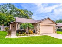 Charming single-story home featuring manicured landscaping and a stone accent facade at 638 Boniview Ln, Altamonte Springs, FL 32714