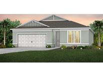 Charming single-Gathering home with a two-car garage, manicured lawn, and beautiful landscaping at 1553 Groveline Rd, St Cloud, FL 34771