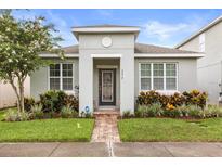 Charming single-story home with a well-manicured lawn, beautiful landscaping, and a welcoming entryway at 2417 Liner Ave, Apopka, FL 32703