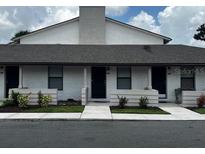 Charming condo with a well-maintained exterior and a neatly landscaped front yard at 3120 Plaza Terrace Dr # 3120, Orlando, FL 32803