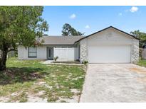 Charming single-story home with a spacious two-car garage and partially xeriscaped front yard at 3187 Shady Willow Dr, Orlando, FL 32808