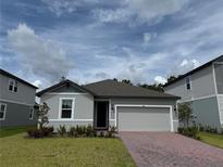 Charming single-Gathering home with a two-car garage, a well-manicured lawn and beautiful landscaping at 368 Birkdale Dr, Daytona Beach, FL 32124