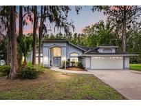 Charming single Gathering home with lush landscaping and a two-car garage at 4026 S Lake Orlando Pkwy, Orlando, FL 32808