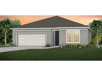 Charming single-story home with a gray exterior, well-manicured lawn, and a two-car garage at 1562 Timber Leaf Rd, St Cloud, FL 34771