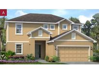 Inviting two-story home featuring a tan exterior, a two-car garage, and a beautifully landscaped front yard at 2256 Sirena Ln, Mount Dora, FL 32757